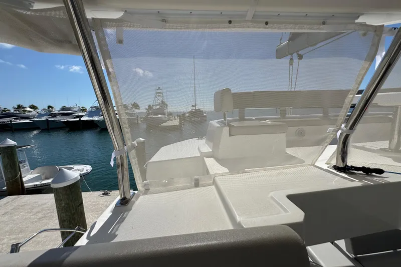 Slide: The Image of 2021 Leopard 45 yacht interior view at marina, with boats and clear sky. - 61
