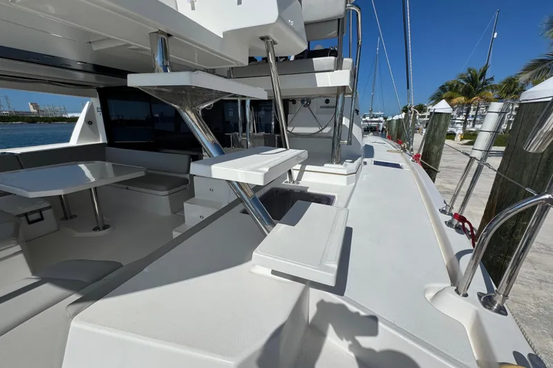 Slide: The Image of Leopard 45 catamaran deck, 2021 model, featuring modern seating and sleek design. - 66