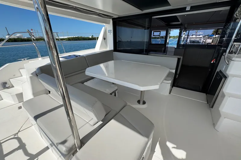 Slide: The Image of Leopard 45 catamaran 2021 model, featuring spacious outdoor seating and dining area. - 68