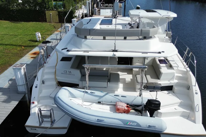 Slide: The Image of 2021 Leopard 45 yacht docked with inflatable boat on stern. - 7