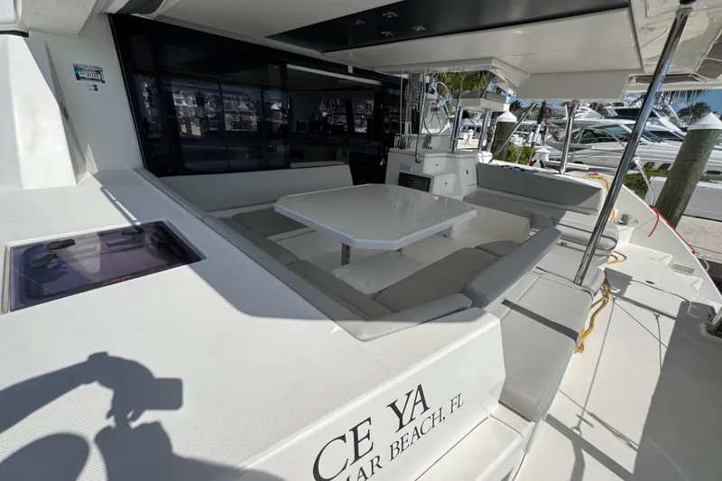 Slide: The Image of Leopard 45 catamaran, 2021 model, featuring spacious outdoor seating and dining area. - 72