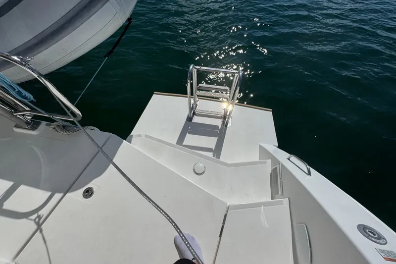 Slide: The Image of Sleek deck of 2021 Leopard 45 yacht with ladder and ocean view. - 74