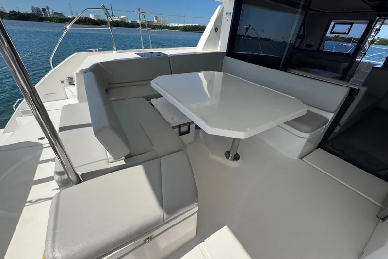 Slide: The Image of Leopard 45 catamaran 2021 model, featuring spacious outdoor seating and dining area. - 75