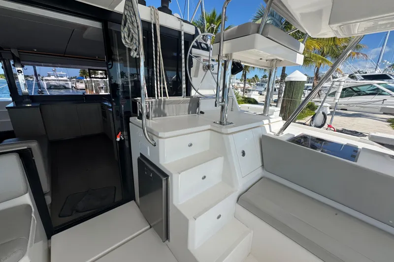 Slide: The Image of Interior view of a 2021 Leopard 45 catamaran, showcasing modern design and marina backdrop. - 78