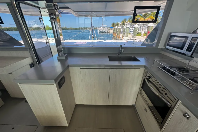 Slide: The Image of Modern kitchen interior on a 2021 Leopard 45 catamaran with ocean view. - 95