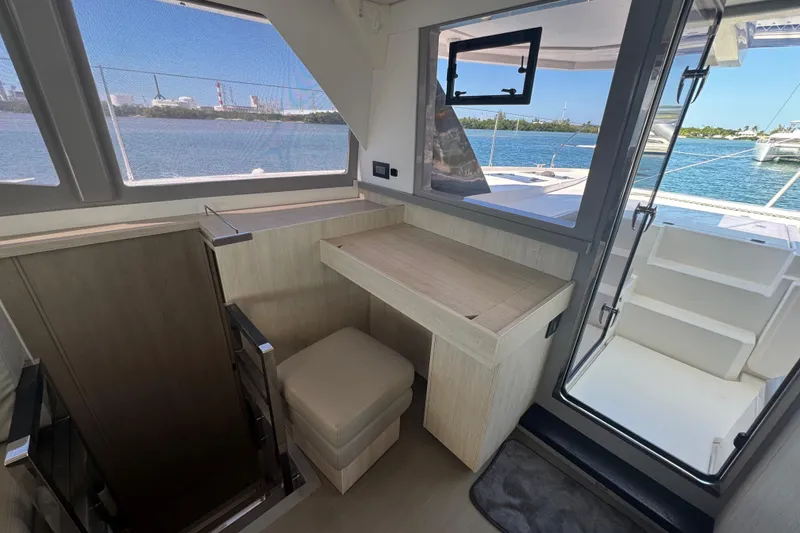 Slide: The Image of Interior of 2021 Leopard 45 yacht with desk, window, and ocean view. - 96