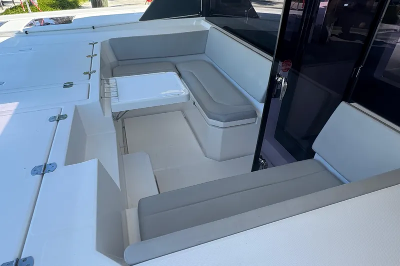 Slide: The Image of 2021 Leopard 45 yacht interior with cushioned seating and table. - 99