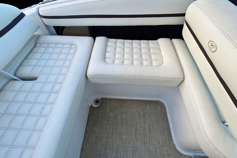 Slide: The Image of White leather seating in a 2019 Cobalt R3 boat interior. - 11