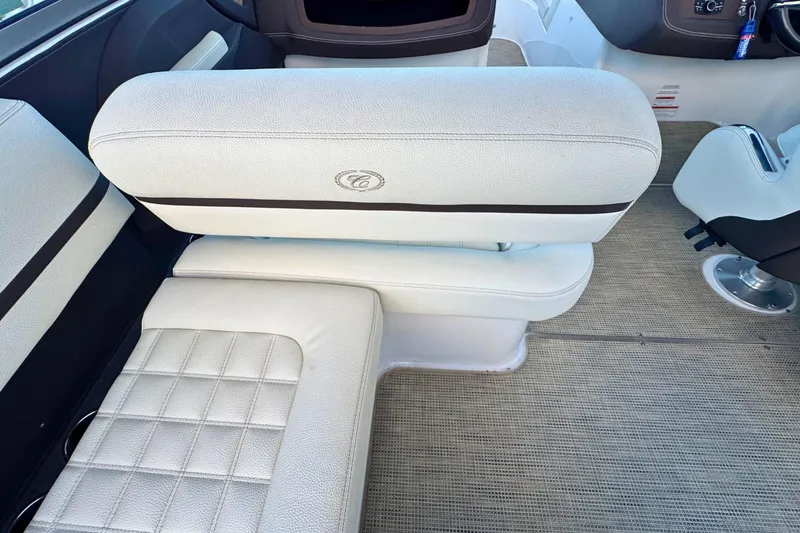 Slide: The Image of 2019 Cobalt R3 boat interior with white cushioned seating and carpeted flooring. - 13