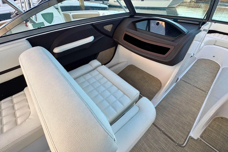 Slide: The Image of 2019 Cobalt R3 boat interior with white seating and modern dashboard design. - 20