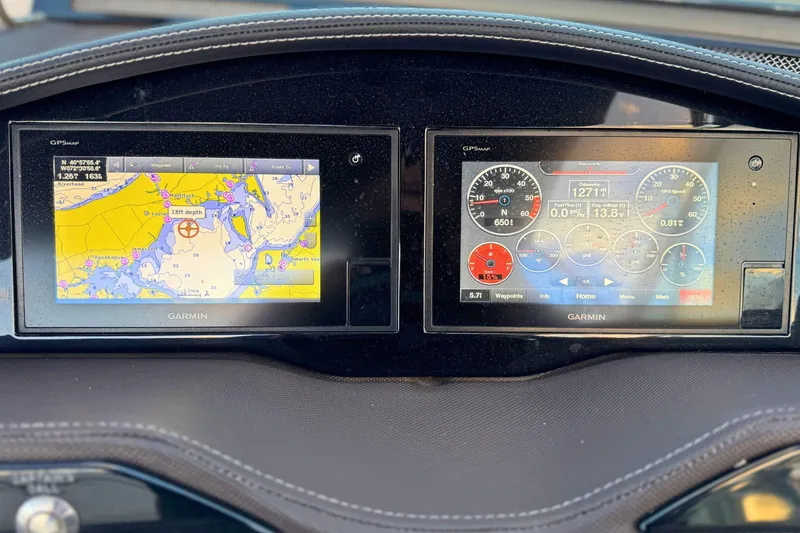 Slide: The Image of Dashboard of a 2019 Cobalt R3 boat with Garmin navigation displays. - 27