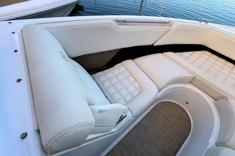 Slide: The Image of Luxurious white seating on a 2019 Cobalt R3 boat, near water. - 34