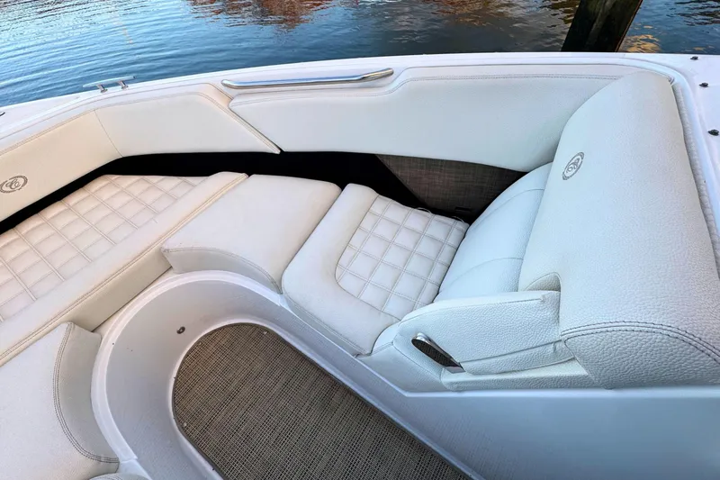 Slide: The Image of Luxurious seating on a 2019 Cobalt R3 boat, featuring white upholstery and elegant design. - 35