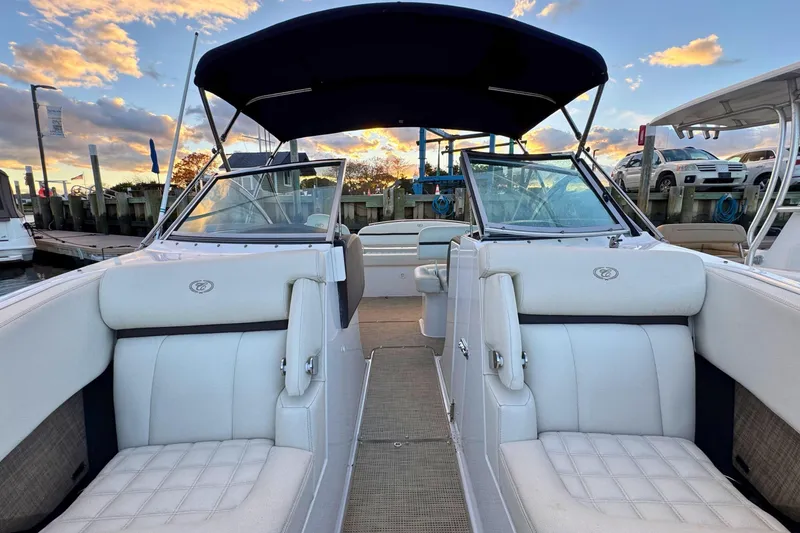 Slide: The Image of 2019 Cobalt R3 boat with white seating, docked at sunset. - 38
