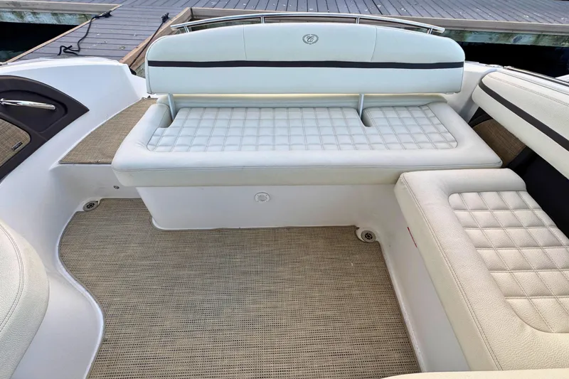Slide: The Image of 2019 Cobalt R3 boat interior with white cushioned seating and beige flooring. - 9