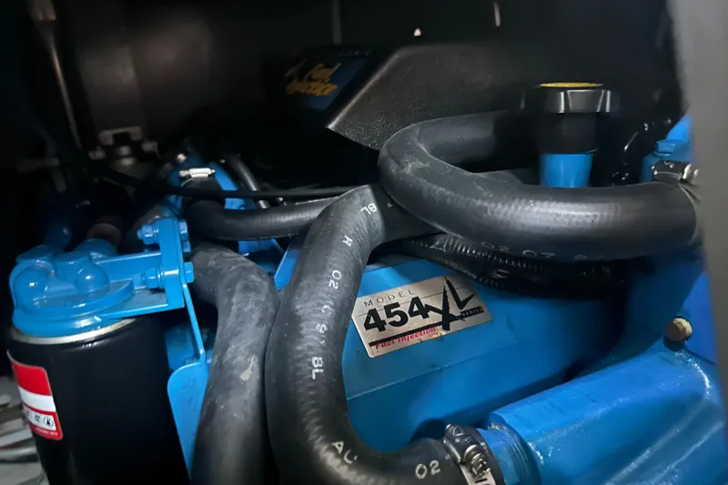 Slide: The Image of 1998 Silverton 372 Motor Yacht interior with green seating and wooden table. - 19