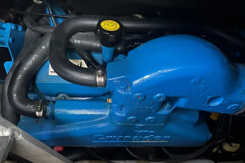 Slide: The Image of 1998 Silverton 372 Motor Yacht interior with green leather seating and wooden table. - 20