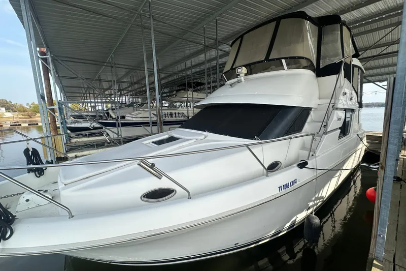 Slide: The Image of 1998 Silverton 372 Motor Yacht docked, named "The Good Life," located in Henrietta, TX. - 6