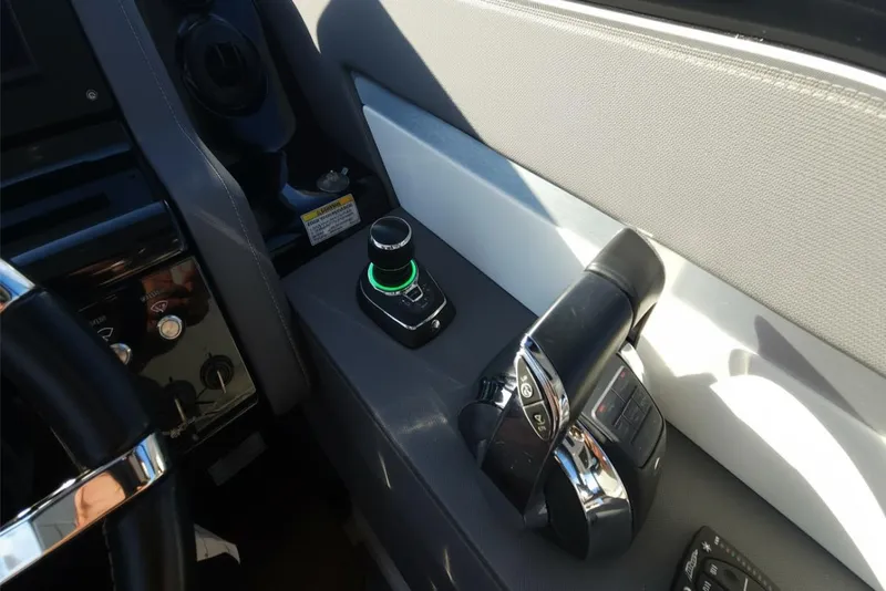 Slide: The Image of 2021 Cruisers Yachts 42 GLS OB helm controls with joystick and throttle. - 20