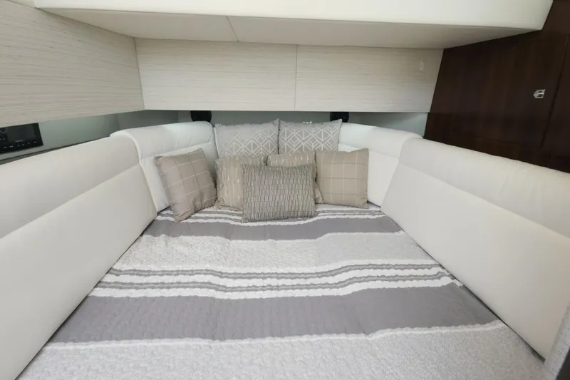 Slide: The Image of Luxurious cabin interior of 2021 Cruisers Yachts 42 GLS OB with plush bedding. - 25
