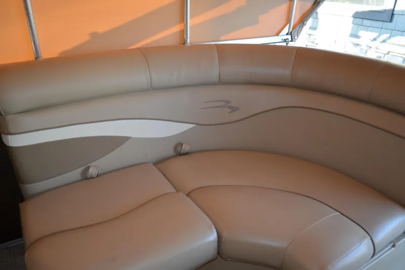 Slide: The Image of 2018 Bennington 21 SSRX boat interior with beige leather seating. - 12