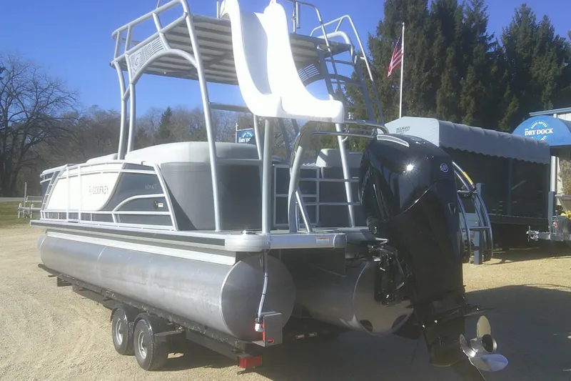 Slide: The Image of 2024 Godfrey Monaco 255 SD pontoon boat with slide and outboard motor. - 14