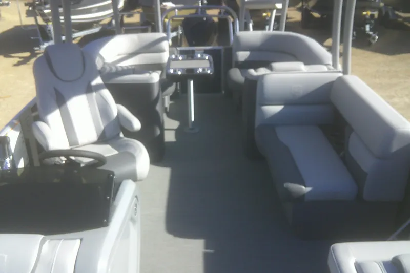 Slide: The Image of 2024 Godfrey Monaco 255 SD pontoon boat interior with plush seating and modern design. - 2