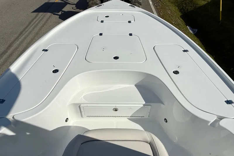 Slide: The Image of 2026 Sea Hunt BX 22 BR boat deck with storage compartments and seating. - 15