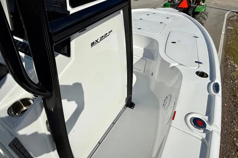 Slide: The Image of 2026 Sea Hunt BX 22 BR boat deck with storage compartments and sleek design. - 16