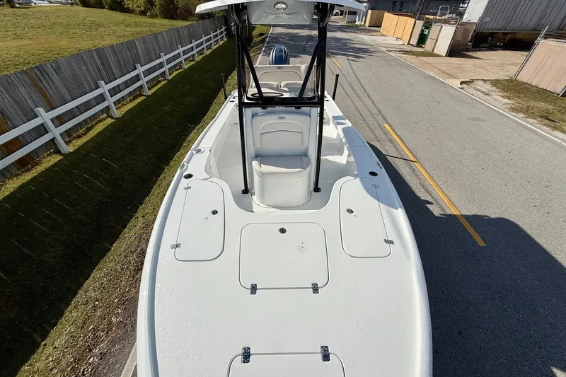 Slide: The Image of 2026 Sea Hunt BX 22 BR boat on a road, showcasing deck and seating. - 17