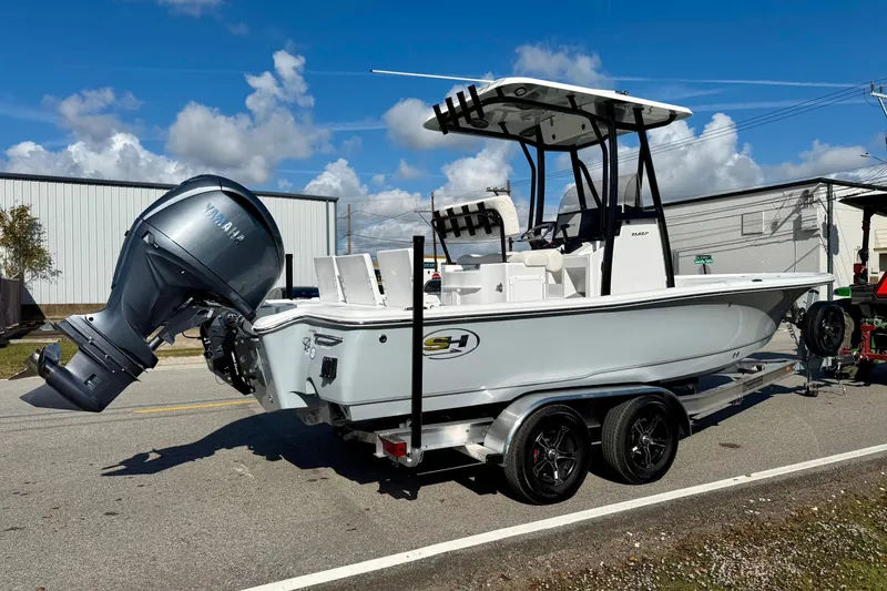 Slide: The Image of 2026 Sea Hunt BX 22 BR boat on trailer, featuring Yamaha outboard motor. - 4