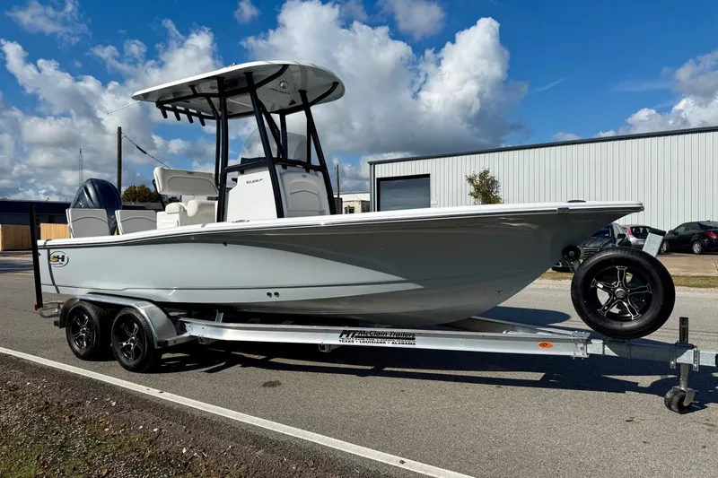 Slide: The Image of 2026 Sea Hunt BX 22 BR boat on trailer under blue sky. - 5