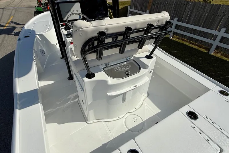 Slide: The Image of 2026 Sea Hunt BX 22 BR boat interior with Garmin equipment and rod holders. - 9
