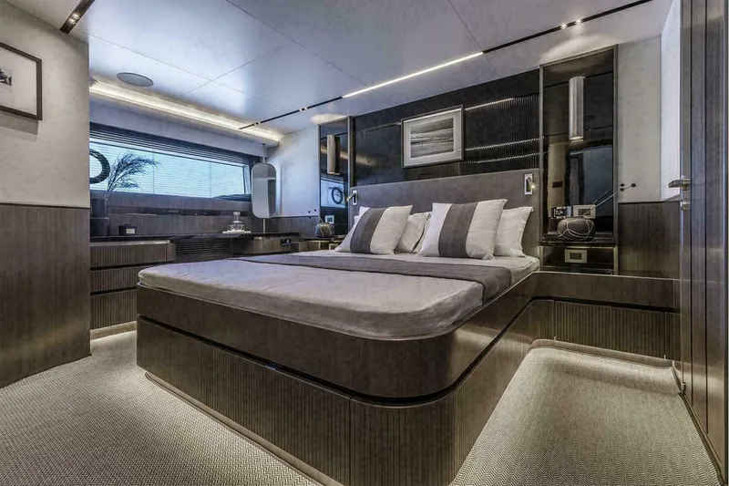 Slide: The Image of Interior of 2025 Pearl 72 yacht cockpit with modern controls and plush seating. - 15