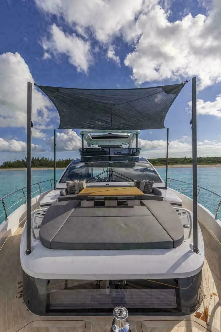 Slide: The Image of Luxurious 2025 Pearl 72 yacht with jet skis, cruising in clear blue waters. - 35