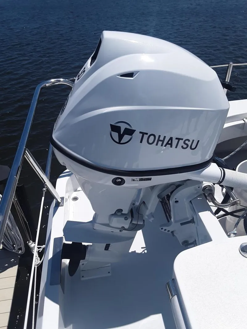 Slide: The Image of 2024 Ultra Lite Tenders Rigged 380 with Tohatsu outboard motor on water. - 8