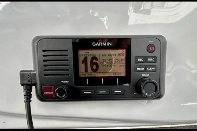 Slide: The Image of Garmin marine radio on 2024 Beneteau Antares 9, displaying distress channel 16. - 24