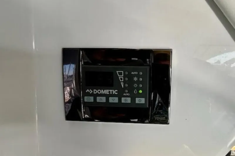 Slide: The Image of Dometic control panel on 2024 Beneteau Antares 9 boat interior. - 25