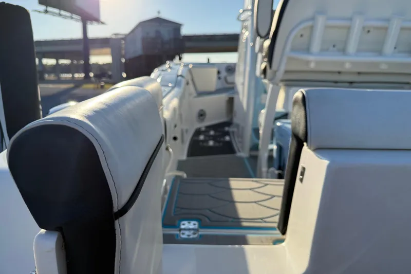 Slide: The Image of 2024 Tidewater 232 LXF boat interior with sleek seating and modern design. - 10