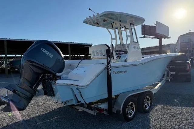 Slide: The Image of 2024 Tidewater 232 LXF boat on trailer with Yamaha outboard motor in sunny setting. - 4