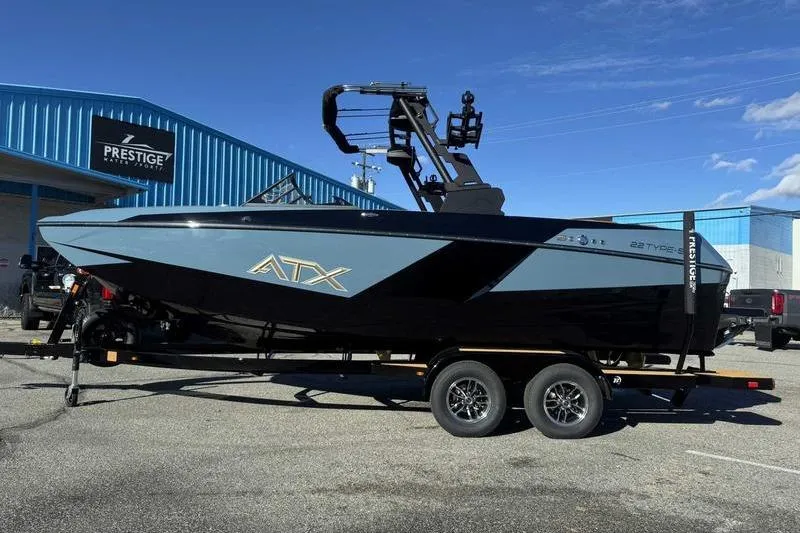 The Image of 2026 ATX Surf Boats 22 Type-S on trailer, parked outside Prestige dealership. - 0