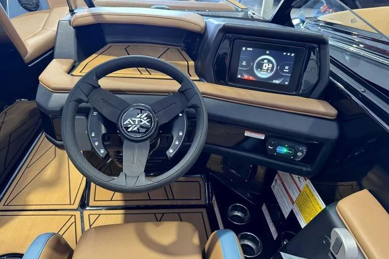 Slide: The Image of 2026 ATX Surf Boats 22 Type-S dashboard with steering wheel and digital display. - 13