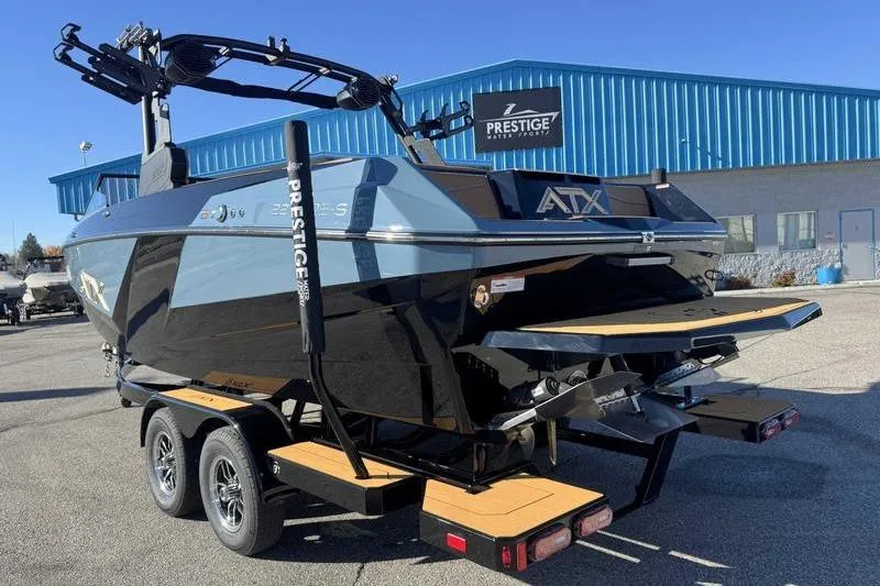 Slide: The Image of 2026 ATX Surf Boats 22 Type-S on trailer outside Prestige dealership. - 5