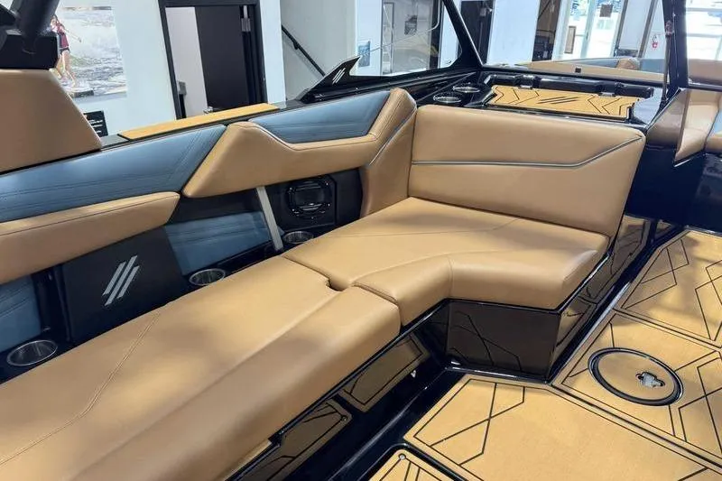 Slide: The Image of 2026 ATX Surf Boats 22 Type-S interior with tan and blue seating, modern design. - 6