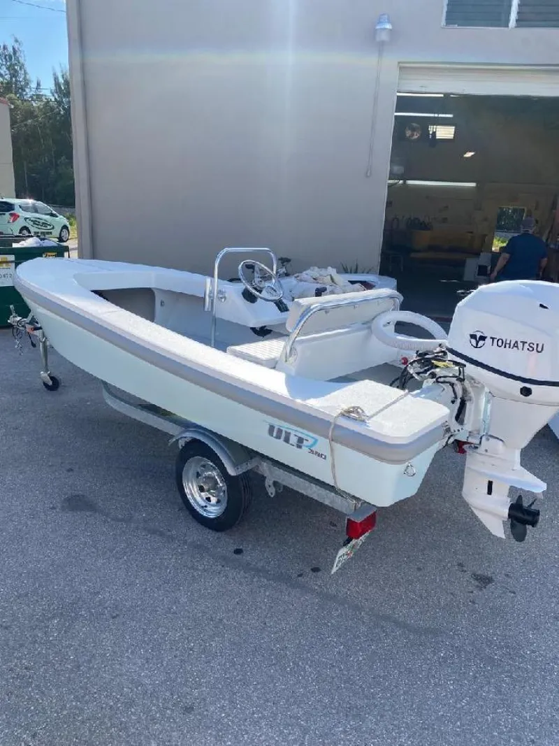 Slide: The Image of 2024 Ultra Lite Tenders ULT 380 boat with Tohatsu engine on a trailer. - 6