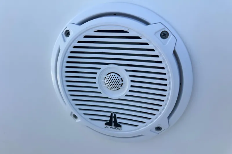 Slide: The Image of White JL Audio speaker on a 2015 Boston Whaler 270 Dauntless boat. - 20