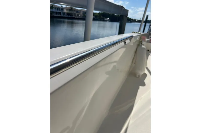 Slide: The Image of 2015 Boston Whaler 270 Dauntless boat railing with waterfront view. - 23