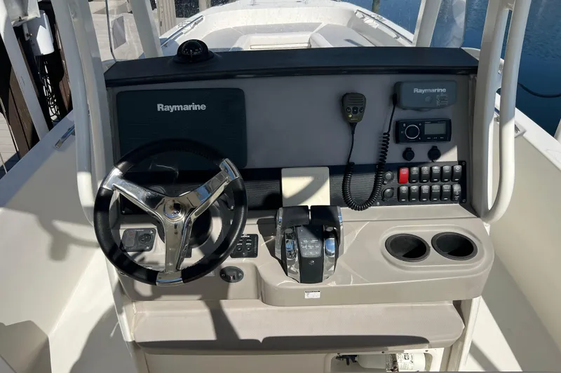 Slide: The Image of 2015 Boston Whaler 270 Dauntless helm with Raymarine electronics and dual cup holders. - 27