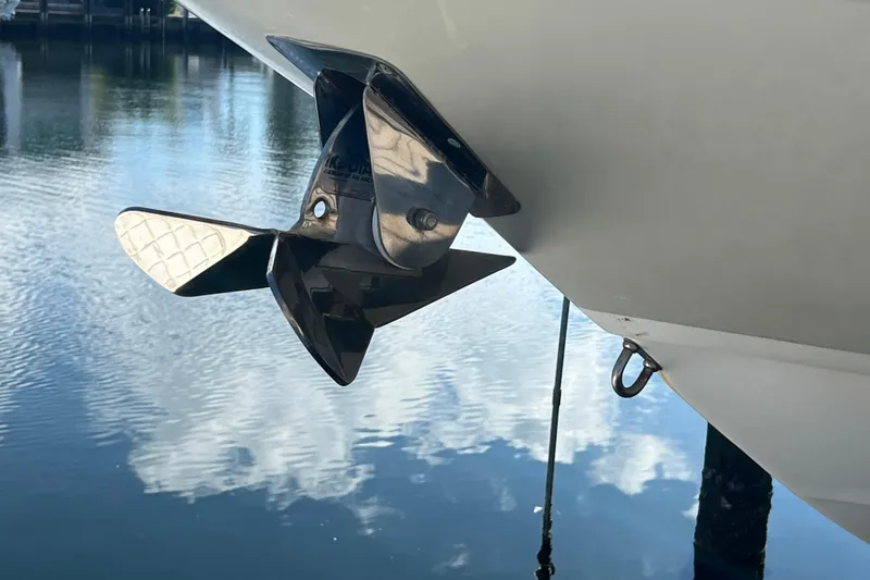 Slide: The Image of Propeller of 2015 Boston Whaler 270 Dauntless boat reflecting on calm water. - 3