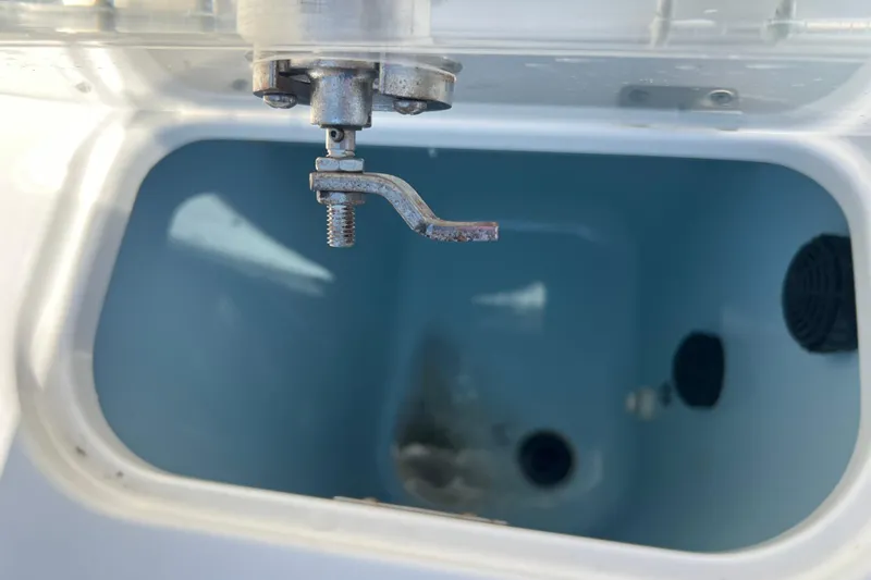 Slide: The Image of Livewell interior of 2015 Boston Whaler 270 Dauntless boat, showing drain and fittings. - 33